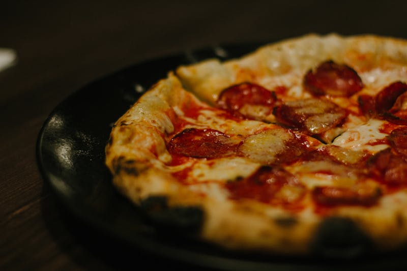 Fresh margherita pizza with basil and mozzarella
